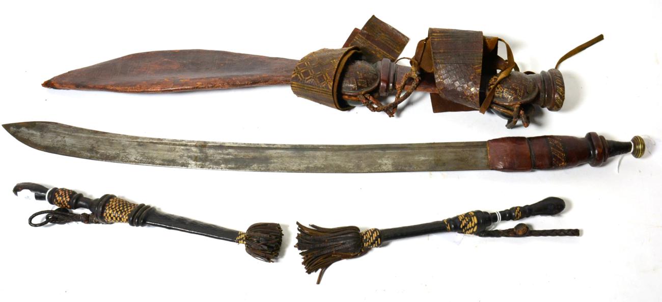 A Tuareg Sword, the 58cm single edge steel blade with two narrow fullers to the back edge and