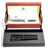 Four Sheaffer pens, comprising of a blue Ronce laque classic rollerball pen, two blue coated