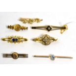 A diamond bar brooch, an old cut diamond in a square setting to a kite shaped frame on a forked bar,