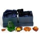 A Lalique frog and five amber miniature frogs