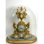 A French painted porcelain and gilt metal figural mantle clock under a glass dome