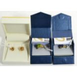 A 9 carat gold peridot ring, a 9 carat gold sapphire ring and a pair of knot earrings (3)