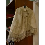 A Victorian cream silk grosgrain cape with lace insertions and trimsLining is split to the top of