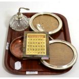 Silver desk calendar, a pair of circular silver frames, silver spoon, scent bottle and a brass Royal