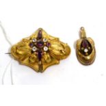 A Victorian garnet and white paste brooch, a central cluster of round cut and pear cut garnets