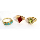 A 9 carat gold peridot and seed pearl cluster ring, an oval cut peridot within a border of seed