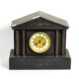 A Victorian slate mantel clock of architectural form, the enamel dial with Arabic numerals