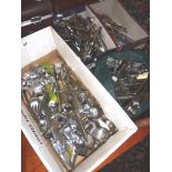 Large quantity of stainless steel cutlery in four boxes