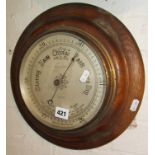 Oak-framed circular aneroid barometer, stamped Botley & Lewis of Reading