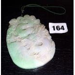 Jade plaque carved with a dragon design to both sides