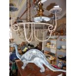 Rustic metal chandelier, and a large Tyco Toys dinosaur