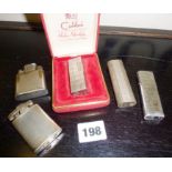 Vintage Colibri lighter in case, with four other lighters