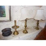 Brass 'drip' candlestick, and two brass table lamps