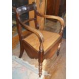 19th c. mahogany elbow chair commode with rope-twist bar back