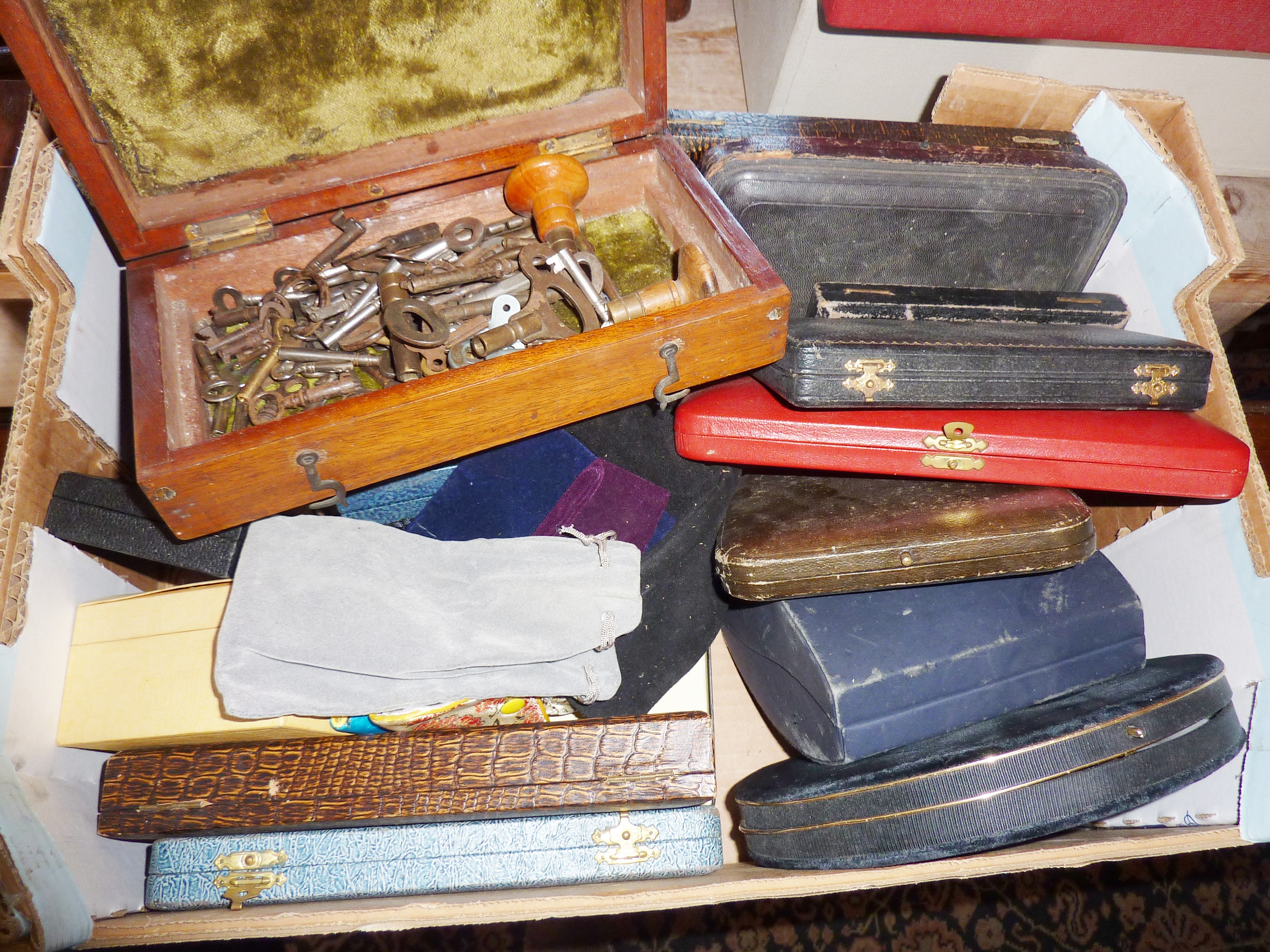 Empty cutlery and jewellery boxes, with a wooden box containing old keys