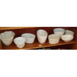 Group of eight various china jelly moulds