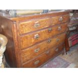 Georgian oak chest of drawers on ogee bracket feet having three dummy drawers and lift-up top