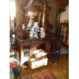 Edwardian mahogany chiffonier having shaped top with bevel-edged mirror & shelves above bow-