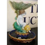 19th c. majolica tazza with boy holding a nautilus shell & riding on a dolphin