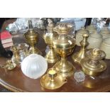 Four brass oil lamps etc, and three shades
