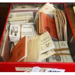 Tin of many unused books of stamps dating 1950s, 60s, and 70s