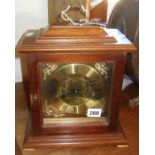 Metamec of England bracket-style chiming mantle clock in mahogany case with brass dial