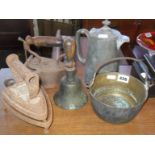 Small brass jam pan, brass hand bell, 2 old irons, trivet & pewter hot water jug.