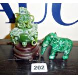 Small Chinese carved spinach jade lidded pot on stand, together with a malachite elephant