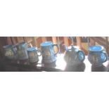 Set of six Dartmouth Pottery blue & white Widecombe Fair jugs, tankards & a teapot