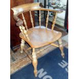 Victorian ash & elm smoker's bow pub elbow chair with turned uprights, legs & stretcher