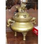 Large Chinese bronze censer with pierced lid and Fo finial, stylised handles, standing on three