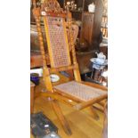 19th c. walnut folding nursing chair with twist uprights and cane seat & back