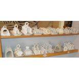 Two shelves of Victorian and later novelty toast racks