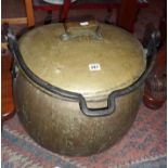 Large antique brass lidded cooking pot with wrought iron handle