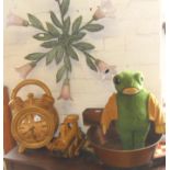 A wooden train and large wooden alarm-style clock, a floral wall light, frog soft toy, chess set