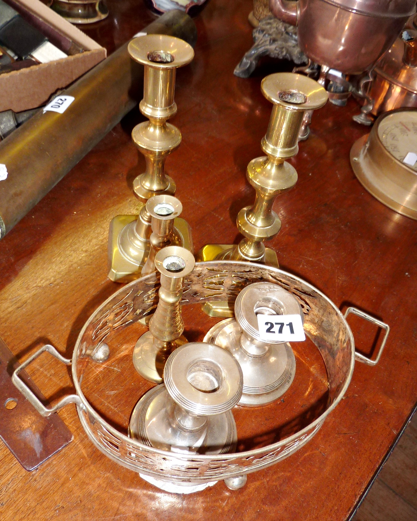 Pair of small silver candlesticks (A/F), and two pairs of brass candlesticks