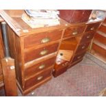 Edwardian pine kneehole pedestal desk of seven drawers with brass cup handles