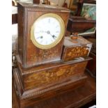 Unusual 19th c. French cigar lighter clock with marquetry panels & a match holder in urn on turned