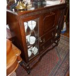 Glazed oak display cabinet with bureau section and drawers under