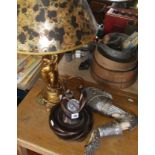 Gold-coloured cherub table lamp, Nemesis Now skeletal arm wall-hung candle-holder, and another lamp