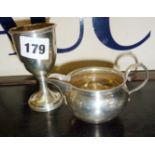 Sydney & Co silver goblet hallmarked Birmingham 1923, and a silver cream jug Birmingham 1924 by