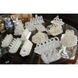 Fourteen old various white china toast racks