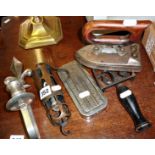 Vintage copper car inspection lamp, a wall sconce, Rolls razor, and an early electric iron on a