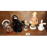 Hummel figure, a Freidel figure, a cow creamer and two glass paperweights etc