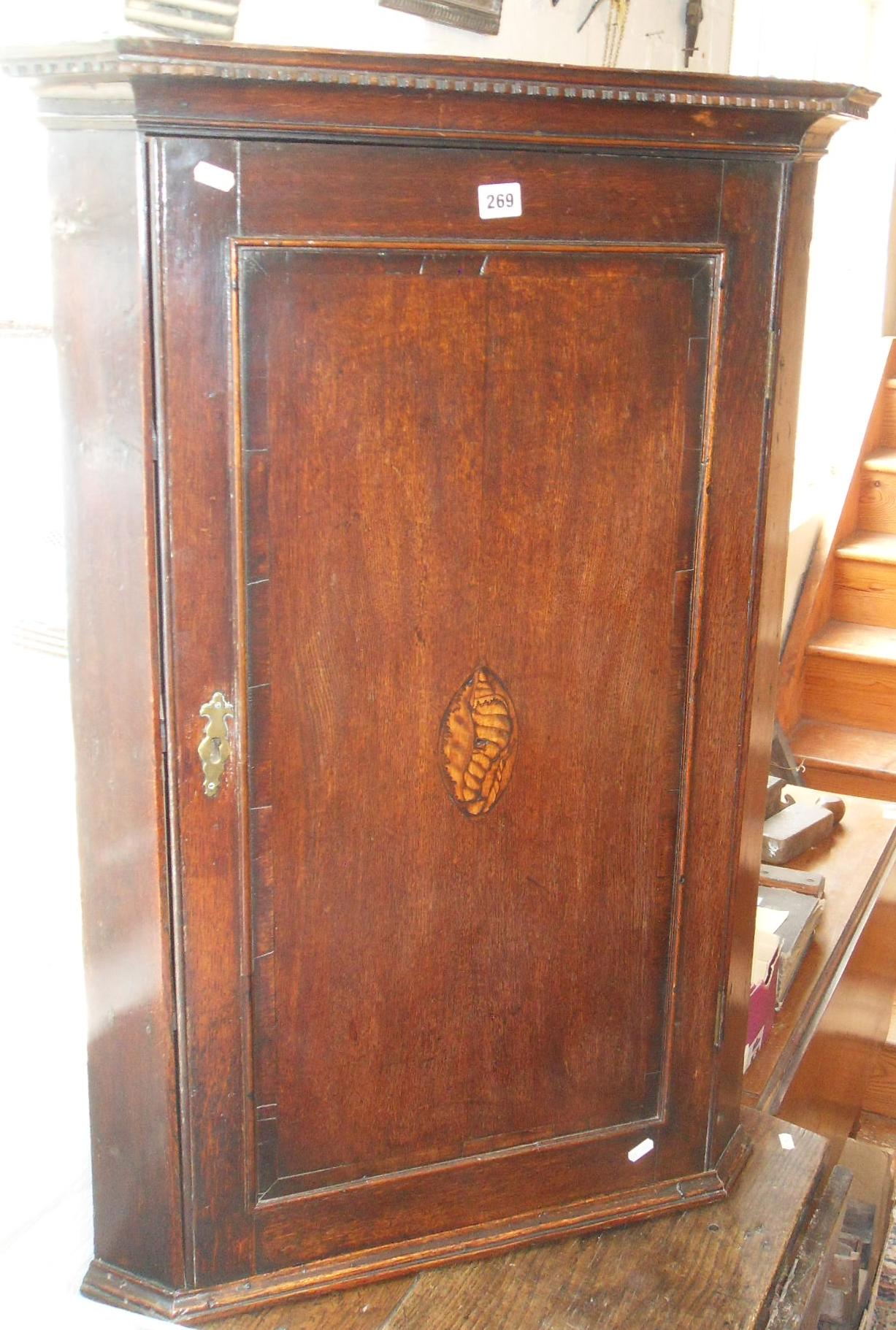 Georgian inlaid oak corner cupboard with shaped shelves & good patina