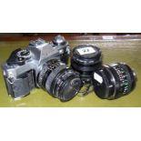 Canon AE-1 camera with two lenses