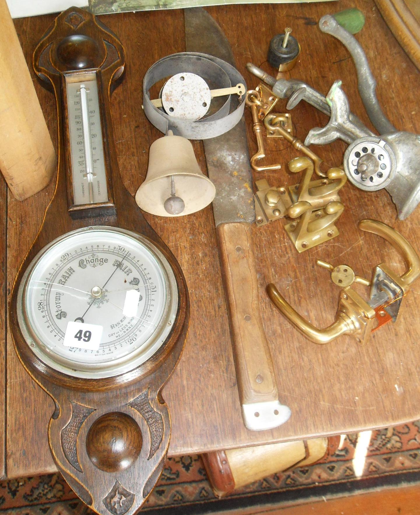 Servant's doorbell, a machete, a barometer, some brass door furniture and a mincer!