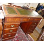 Victorian mahogany sloping kneehole desk with embossed leather inserts and fitted interior
