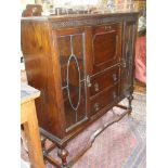 Glazed oak display cabinet with bureau section and drawers under