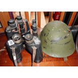 Three pairs of old binoculars (One WW2 marked REL CANADA 1944), a soldier's helmet with liner, and a